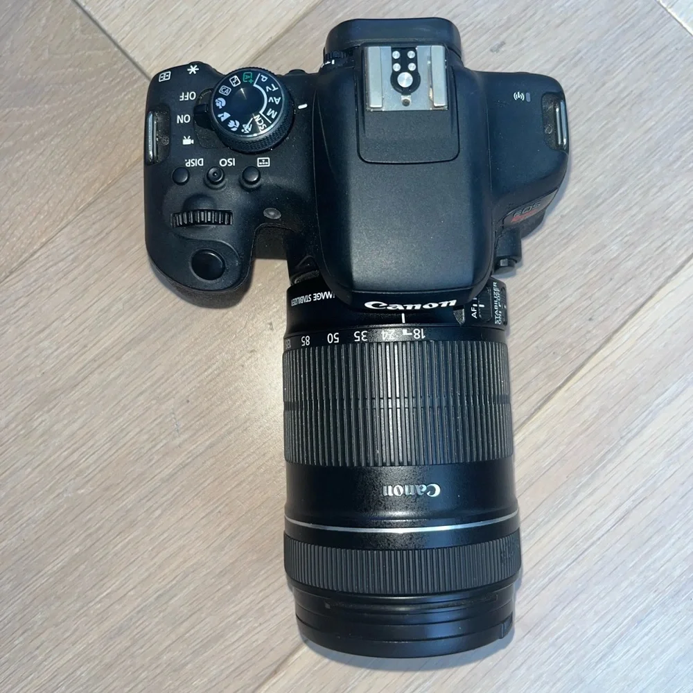 Canon EOS Rebel T6i Digital SLR with EF-S 18-135mm is STM Lens - Wi-Fi Enabled.